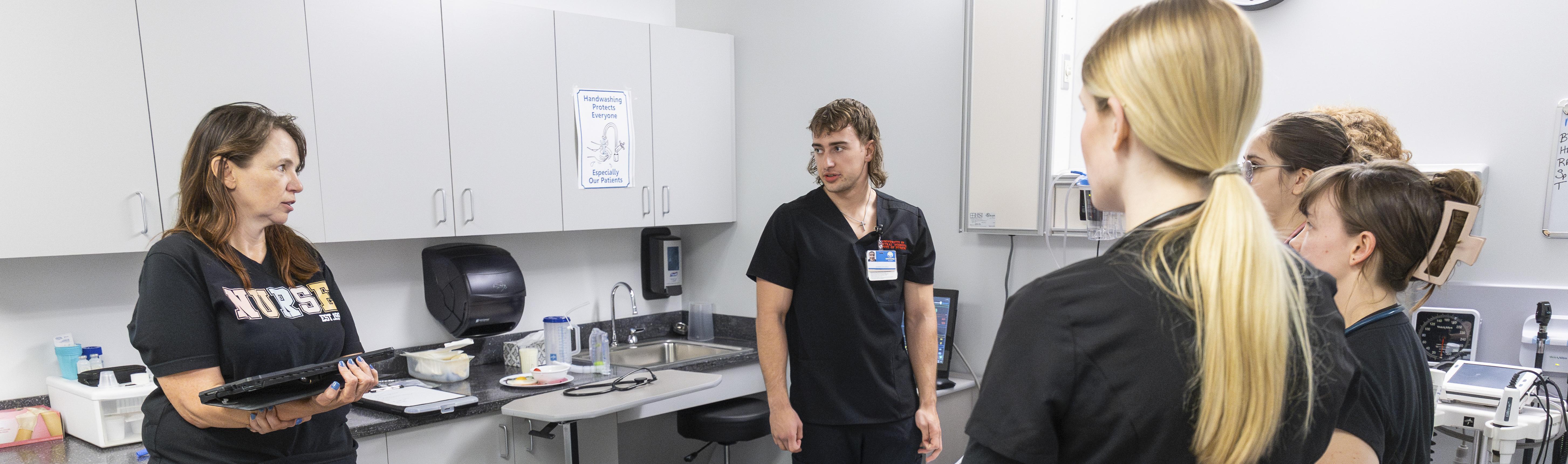 UCM nursing professor and students in a simulation lab UCM nursing professor and students in a simulation lab