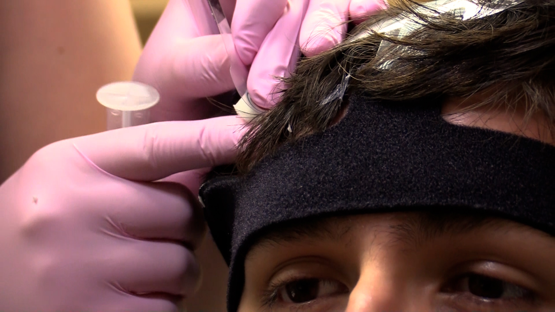 A person wearing an EEG device