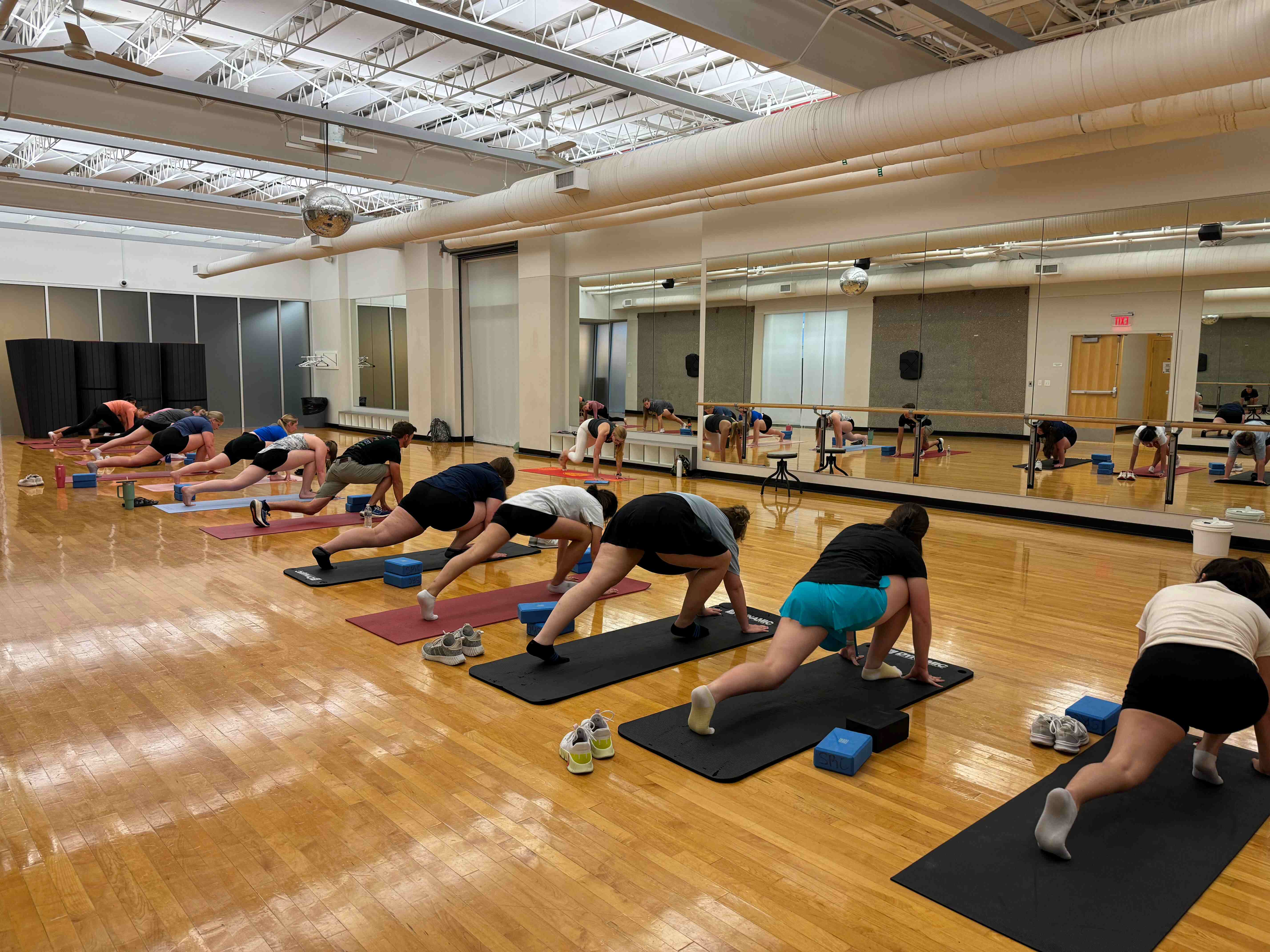 A group in a fitness class doing yoga