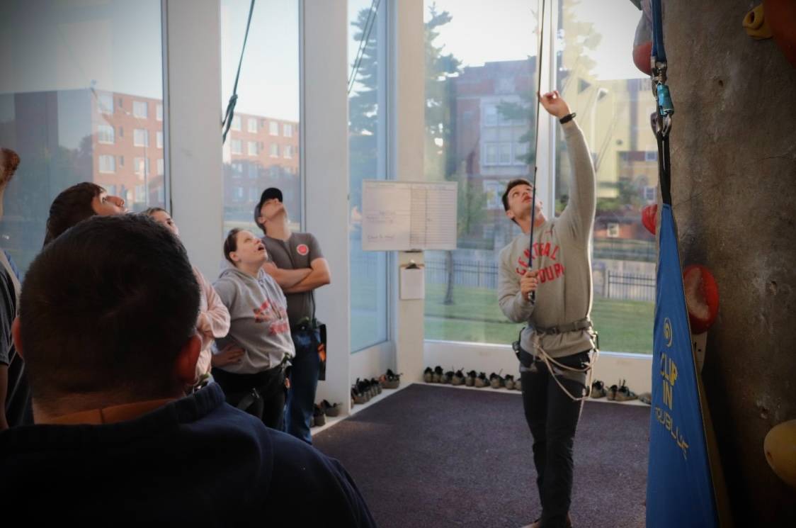 Rock wall staff doing an orientation for visitors