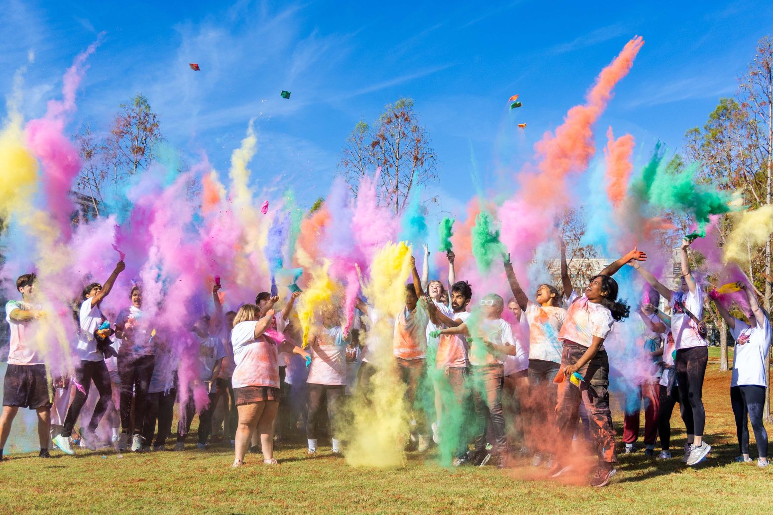 photos of students throwing colored dye at the end of the 2025 color run