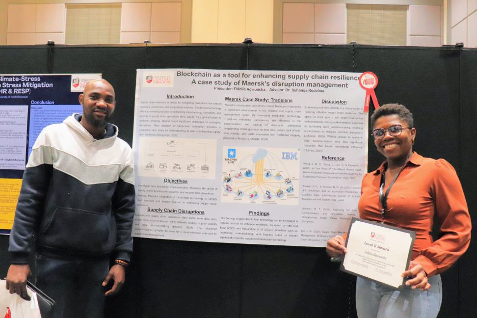 Undergraduate students in front of project. Undergraduate students in front of project.