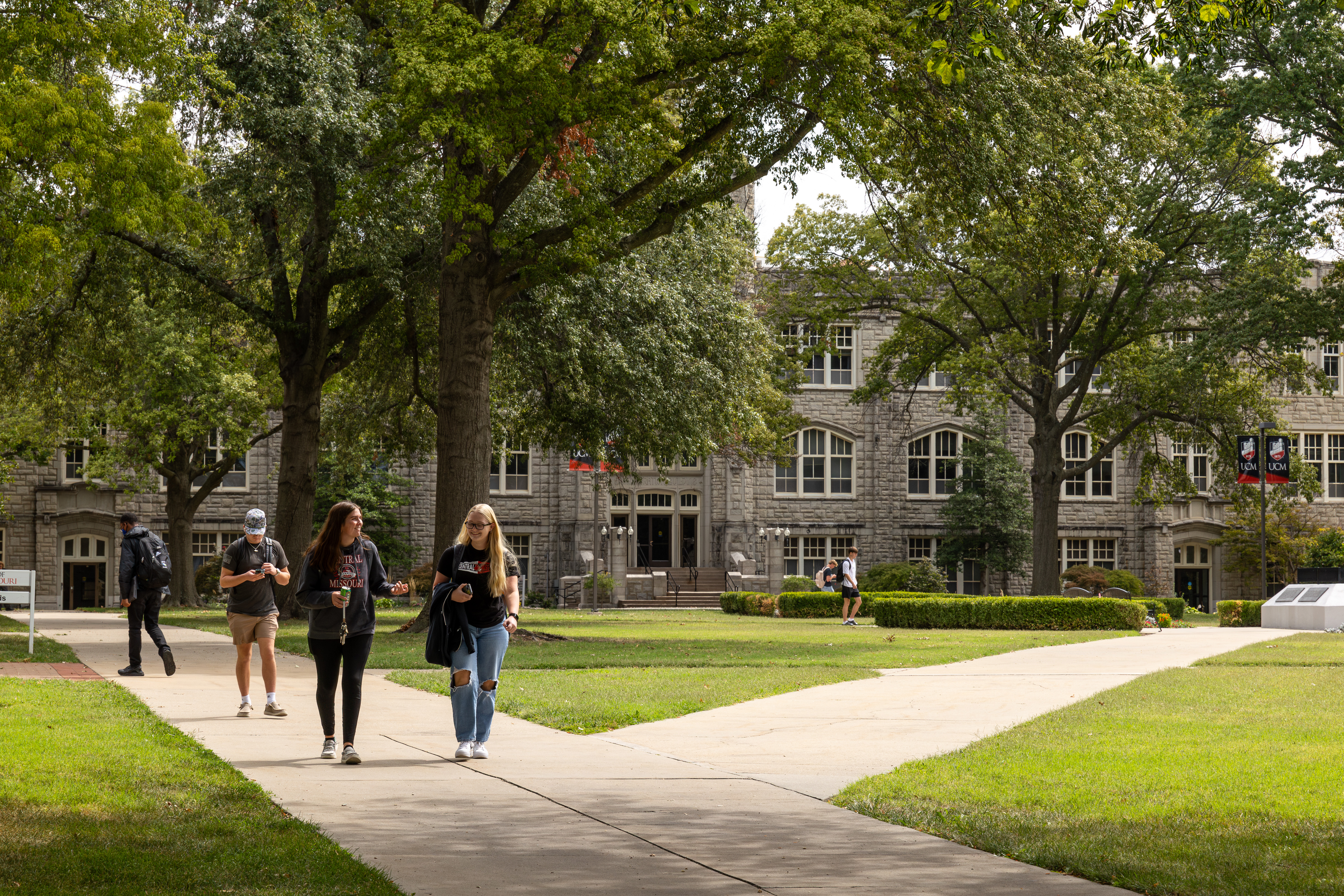 Students walk near Administration Building