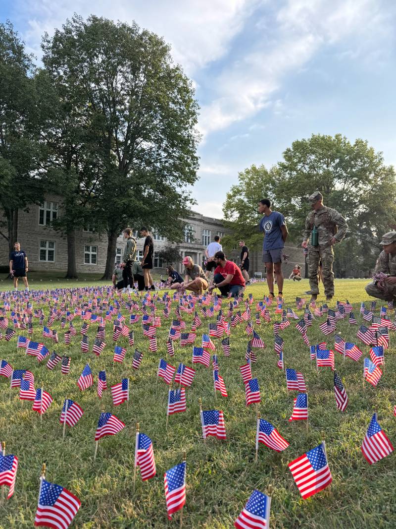 UCM students and staff place American flags