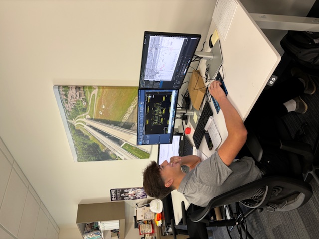 Joshua Lopez, MIC Internship recipient, at his computer.