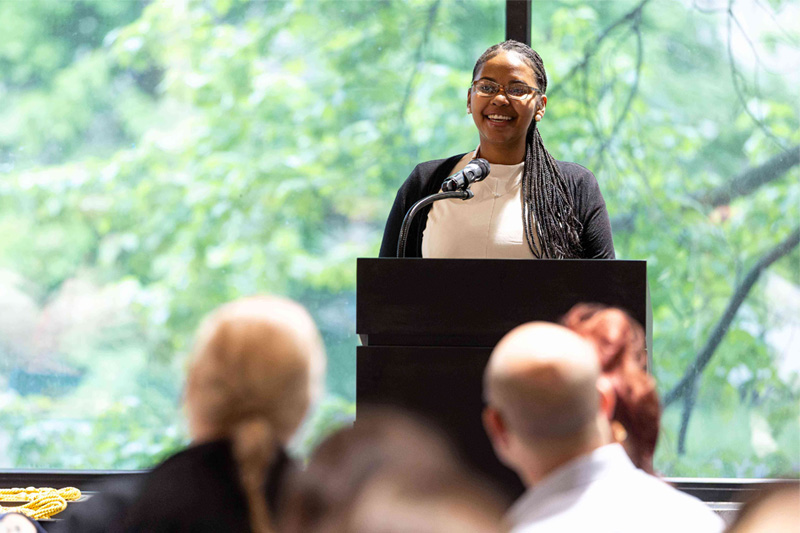 Honors Student Talking Honors student presenting at the Honors College Graduate Dinner.