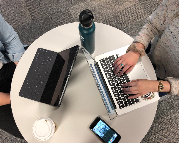 Students using laptops to study