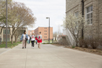 students walking outdoors on campus